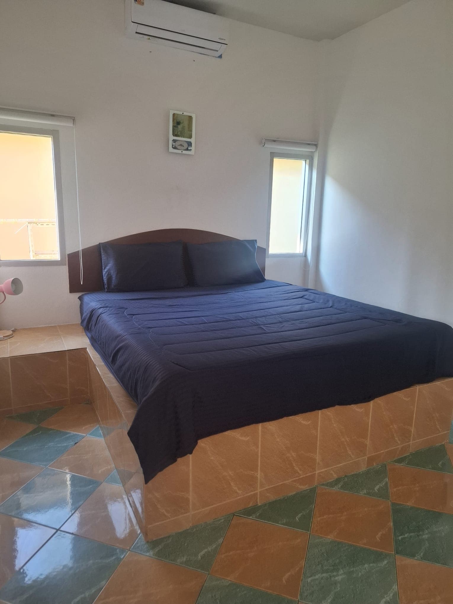 King-size bed in private bungalow